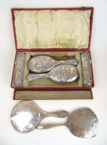 A cased late Victorian silver dressing table set with embossed hunting decoration. Hallmarked for