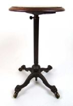 19th century burr walnut and cast iron candle stand/occasional table, the circular top on the