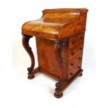 A Victorian burr walnut piano top davenport, the top lifting through a secret mechanism containing