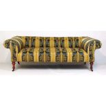 A 19th century walnut sofa upholstered in a striped blue and gold floral patterned fabric, h. 69 cm,