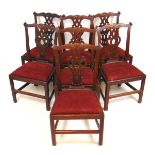 A set of seven 18th century possibly Irish mahogany dining chairs, the carved and shaped cresting