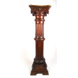 A 19th century oak pedestal, the ionic capital over a fluted column, h. 11 cm, w. 31 cm, d. 31 cm