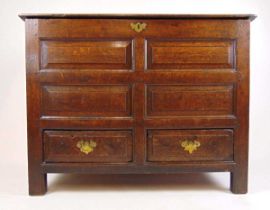 An early 18th century oak mule chest, the top lifting to reveal a vacant interior over the four