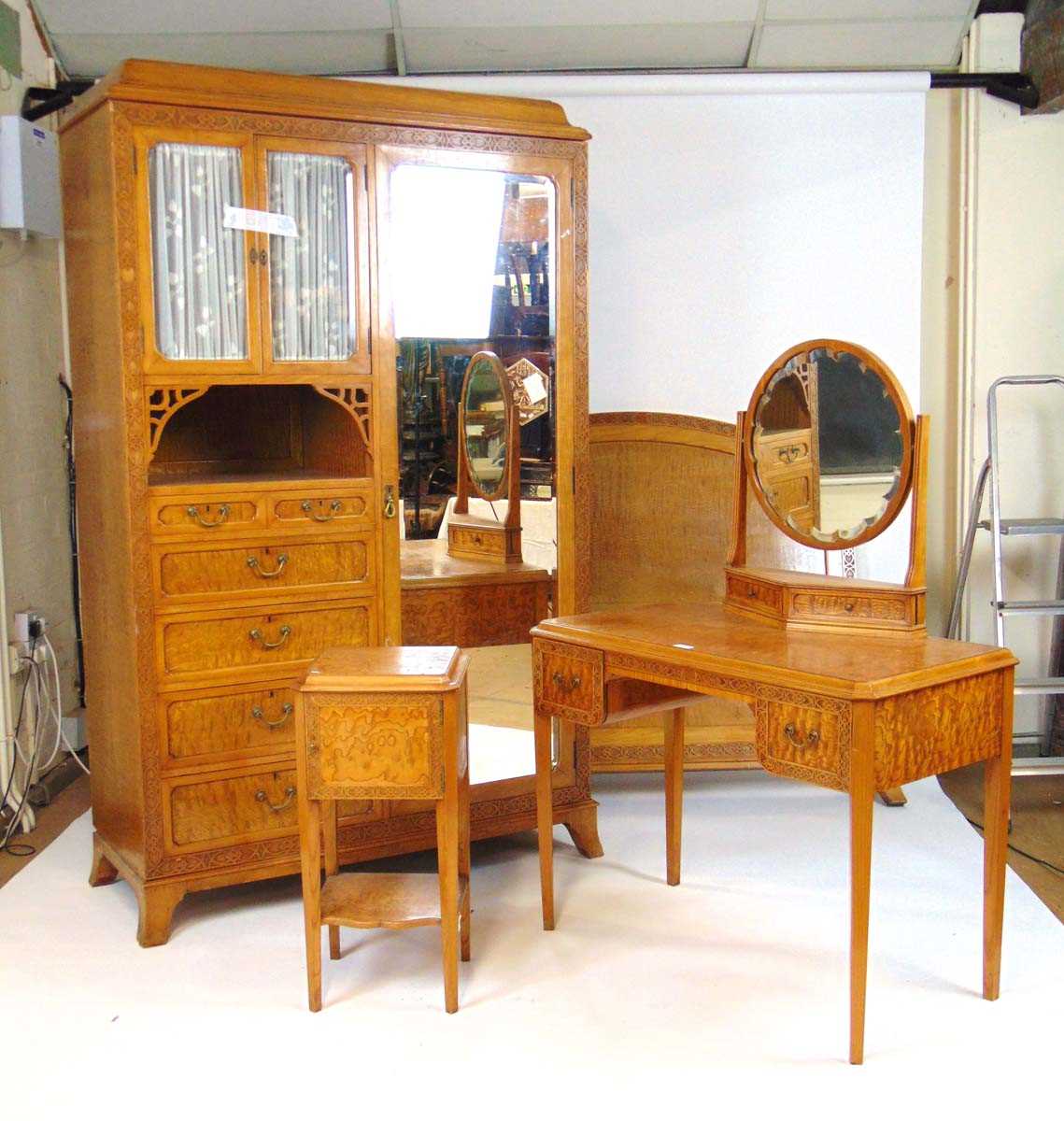 An early 20th century Hungarian/curly ash bedroom suite by Waring and Gillow (Paris) Ltd. comprising