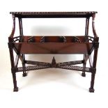 A reproduction mahogany Chippendale style book trough, the gadrooned top over the trough with