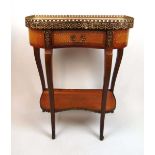 A reproduction French style mahogany and brass mounted side table, the galleried pink marble top