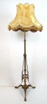 A early 20th century Art Nouveau brass adjustable standard lamp, h. 172 cm No reservoir, converted