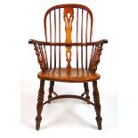 An early 20th century ash, elm and fruitwood Windsor chair, the comb back with a pierced splat