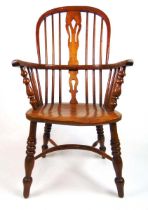 An early 20th century ash, elm and fruitwood Windsor chair, the comb back with a pierced splat