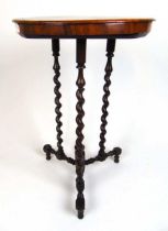 A 19th century rosewood occasional table, the circular top on three barley twist legs on a turned