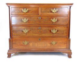 An 18th century mahogany chest of two short over three graduating drawers, the banded top over