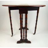 An Edwardian mahogany sutherland table, the drop leaf top on faux bamboo turned legs and stretchers,