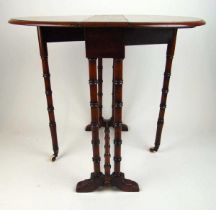 An Edwardian mahogany sutherland table, the drop leaf top on faux bamboo turned legs and stretchers,
