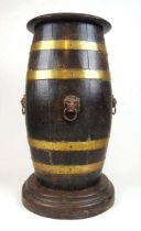 A 19th century oak and brass bound coopered stick stand with tin liner and lion mask handles, h.
