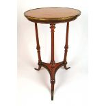 A late 18th century satinwood, purpleheart and brass mounted occasional table, the circular banded