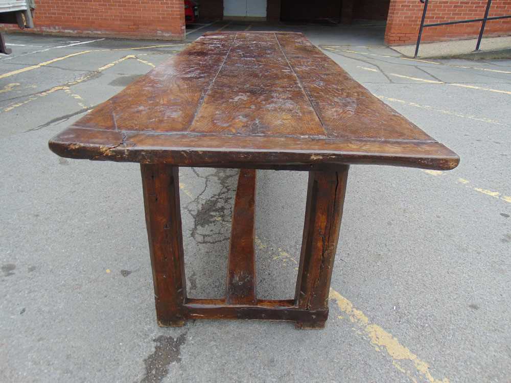 A late 17th century oak refectory table, the three plank cleated top on the base with stop chamfered - Image 3 of 9