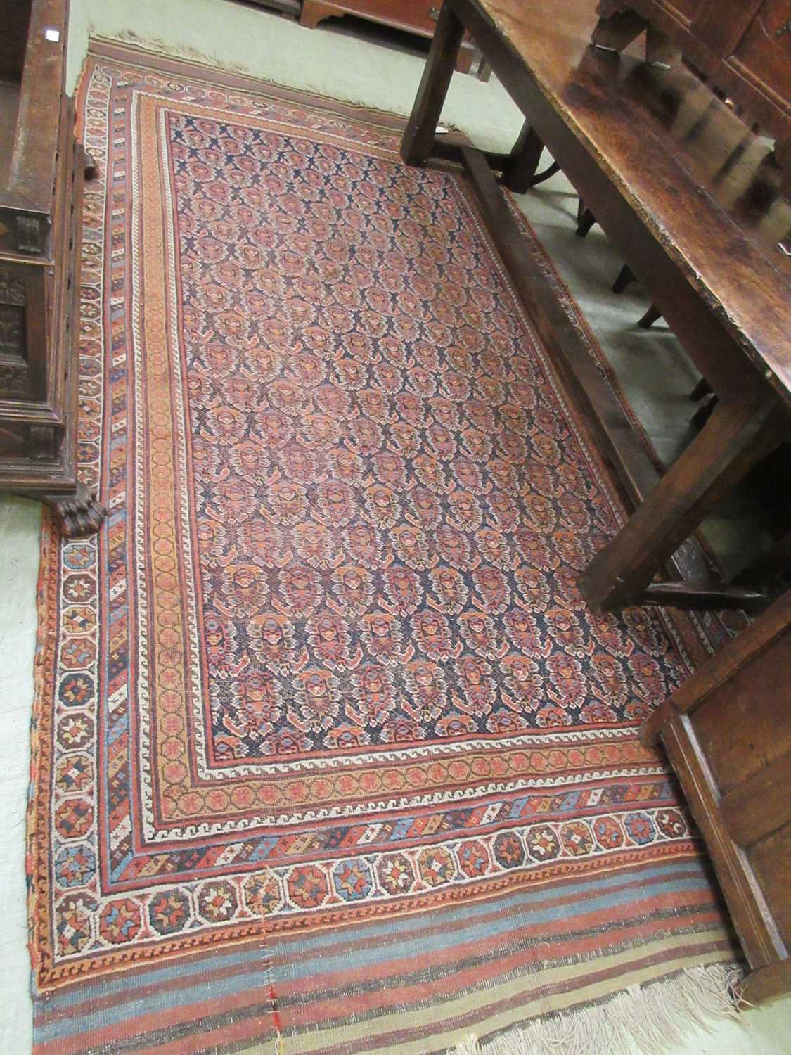 A handwoven Persian rug, possibly Kashan, the multi line border surrounding the blue ground field - Image 5 of 8