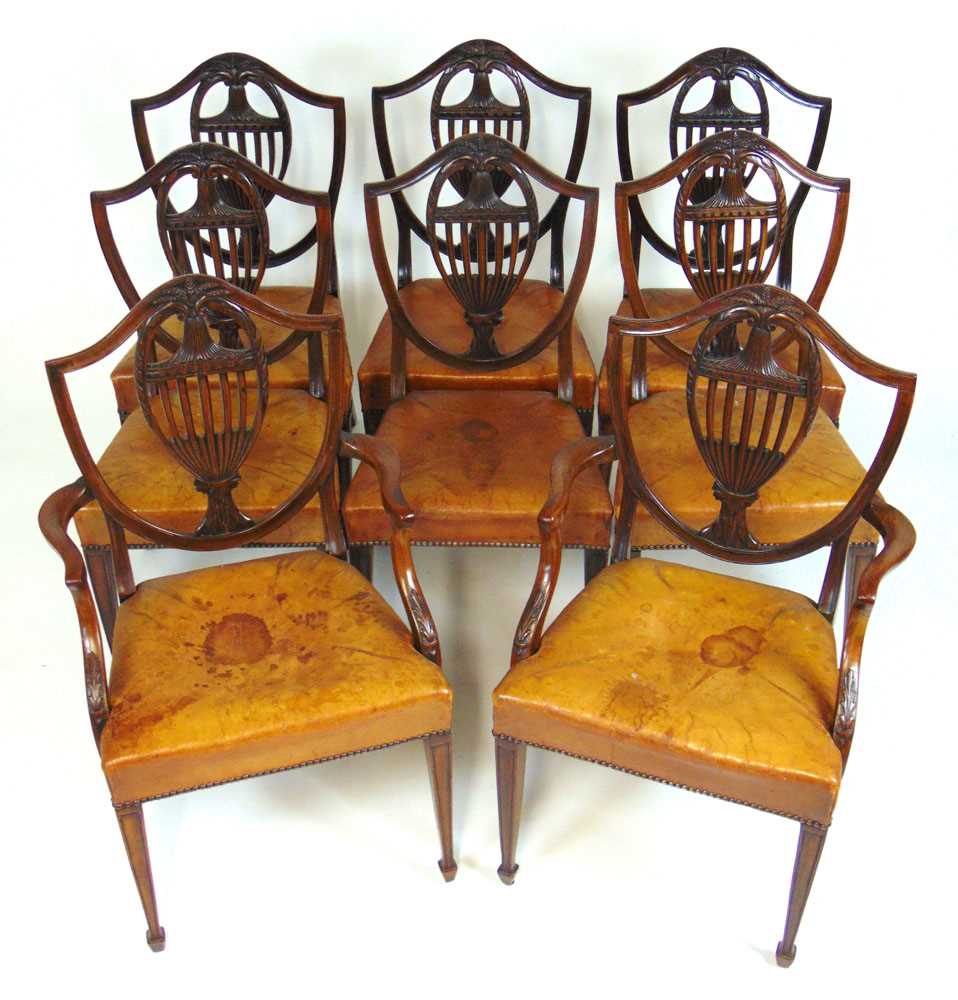 A set of eight early 20th century Hepplewhite style dining chairs upholstered in tan leather, the - Image 4 of 8