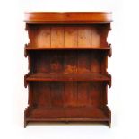An early 20th century walnut open bookcase with display case to top, the case with glazed top over