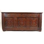 A late 17th/early 18th century walnut and oak coffer, the top lifting to reveal a vacant interior
