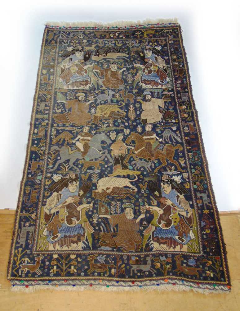 A handwoven Caucasian rug, the main border with animal motifs, surrounding the blue ground field - Image 2 of 5