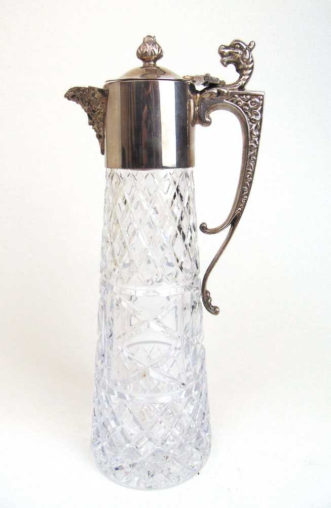 An Elizabeth II silver and cut glass claret jug, the handle with zoomorphic terminal. Hallmarked for