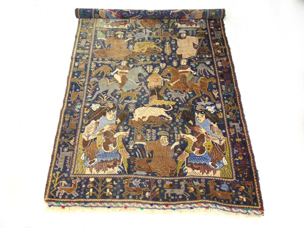 A handwoven Caucasian rug, the main border with animal motifs, surrounding the blue ground field - Image 5 of 5