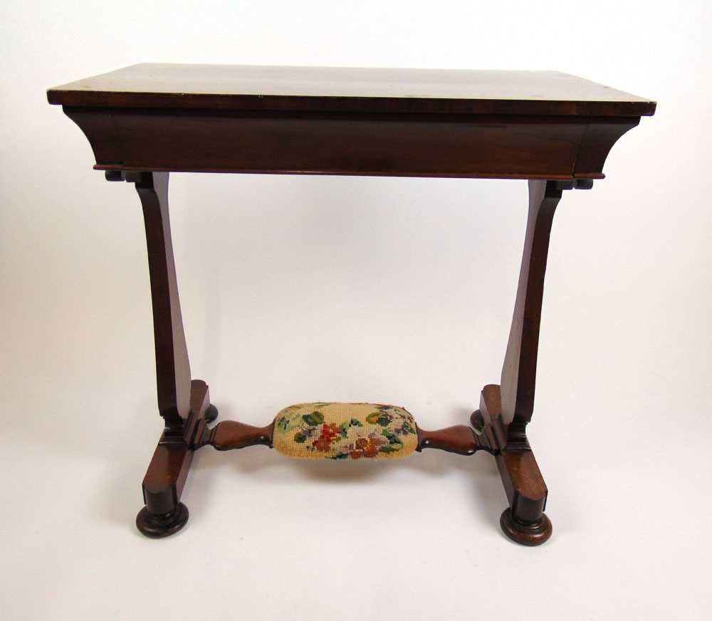 A 19th century mahogany side table, the top over single frieze drawer and slab end supports on squat