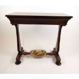 A 19th century mahogany side table, the top over single frieze drawer and slab end supports on squat