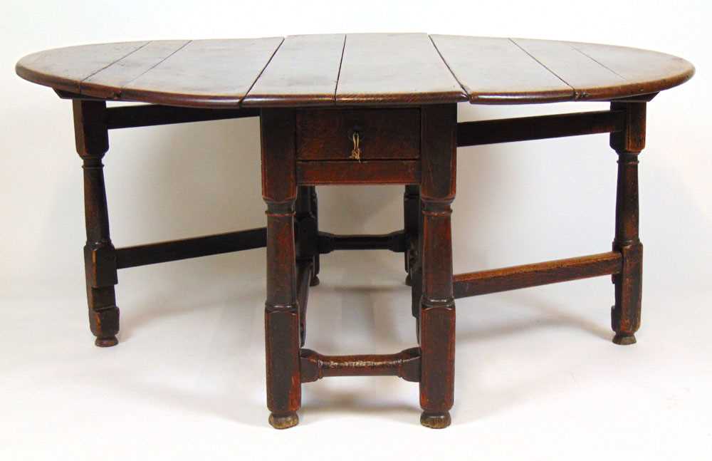 A late 17th/early 18th century oak gate leg dining table, the drop leaf top supported on a single - Image 3 of 3