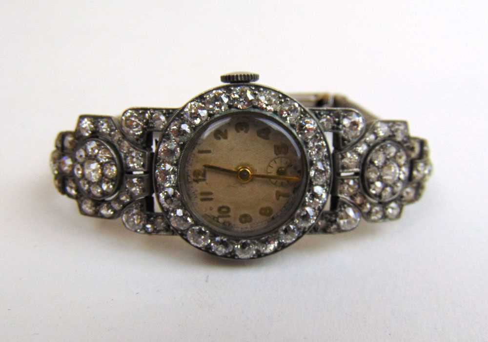A mid 20th century lady's white metal and diamond set cocktail watch. Total diamond weight estimated - Image 3 of 4