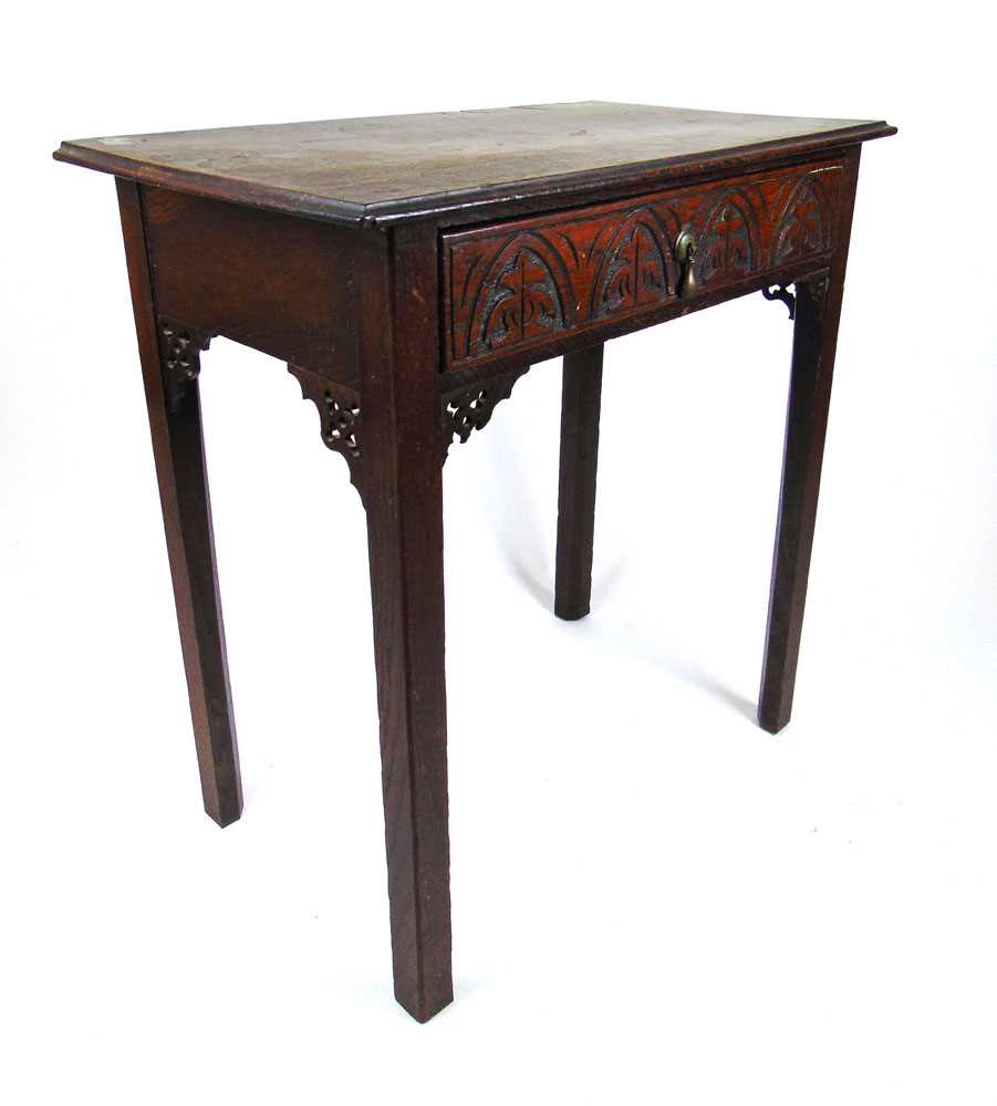 A 19th century oak single drawer side table, the moulded top over the carved drawer on chamfered - Image 2 of 2