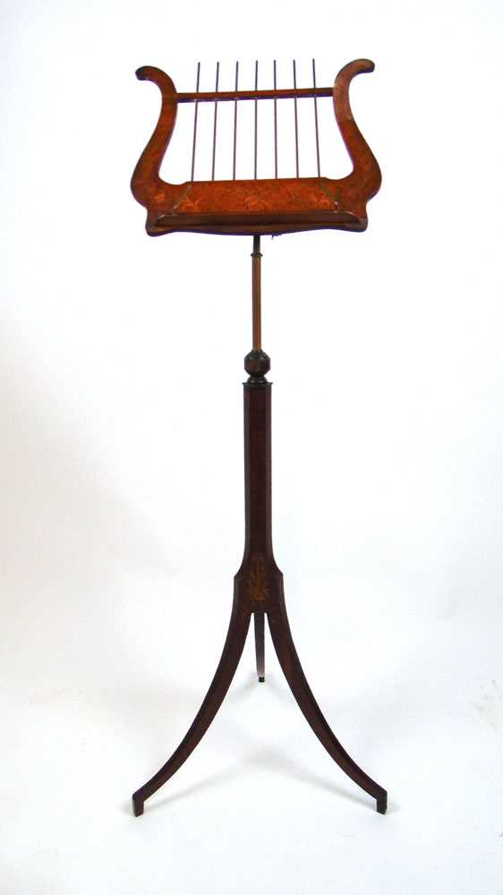 An early 20th century satinwood and marquetry music stand, the lyre slope on adjustable column and