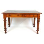 A 19th century oak library table, the top with green tooled leather inset over four side drawers