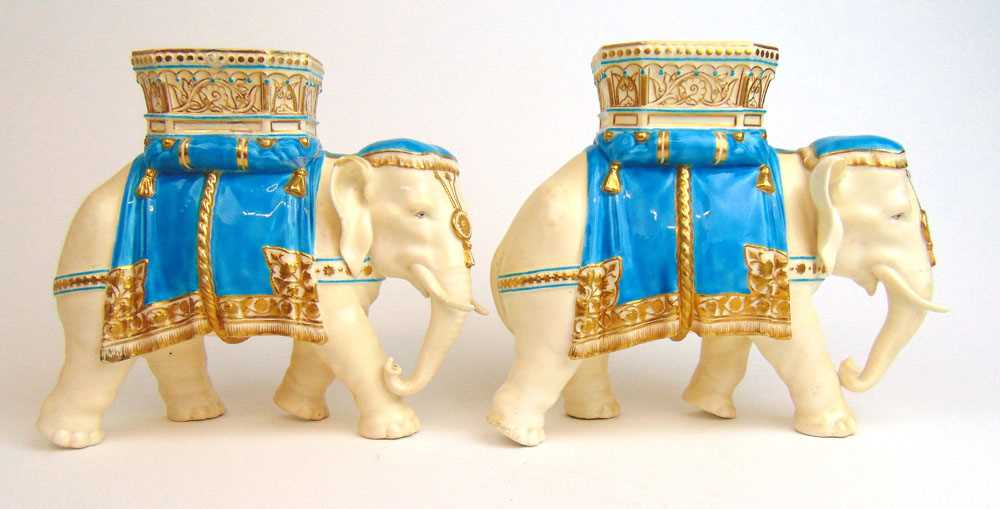 A pair of 19th century Royal Worcester vases in the form of elephants carrying howdahs, glazed in - Image 2 of 2