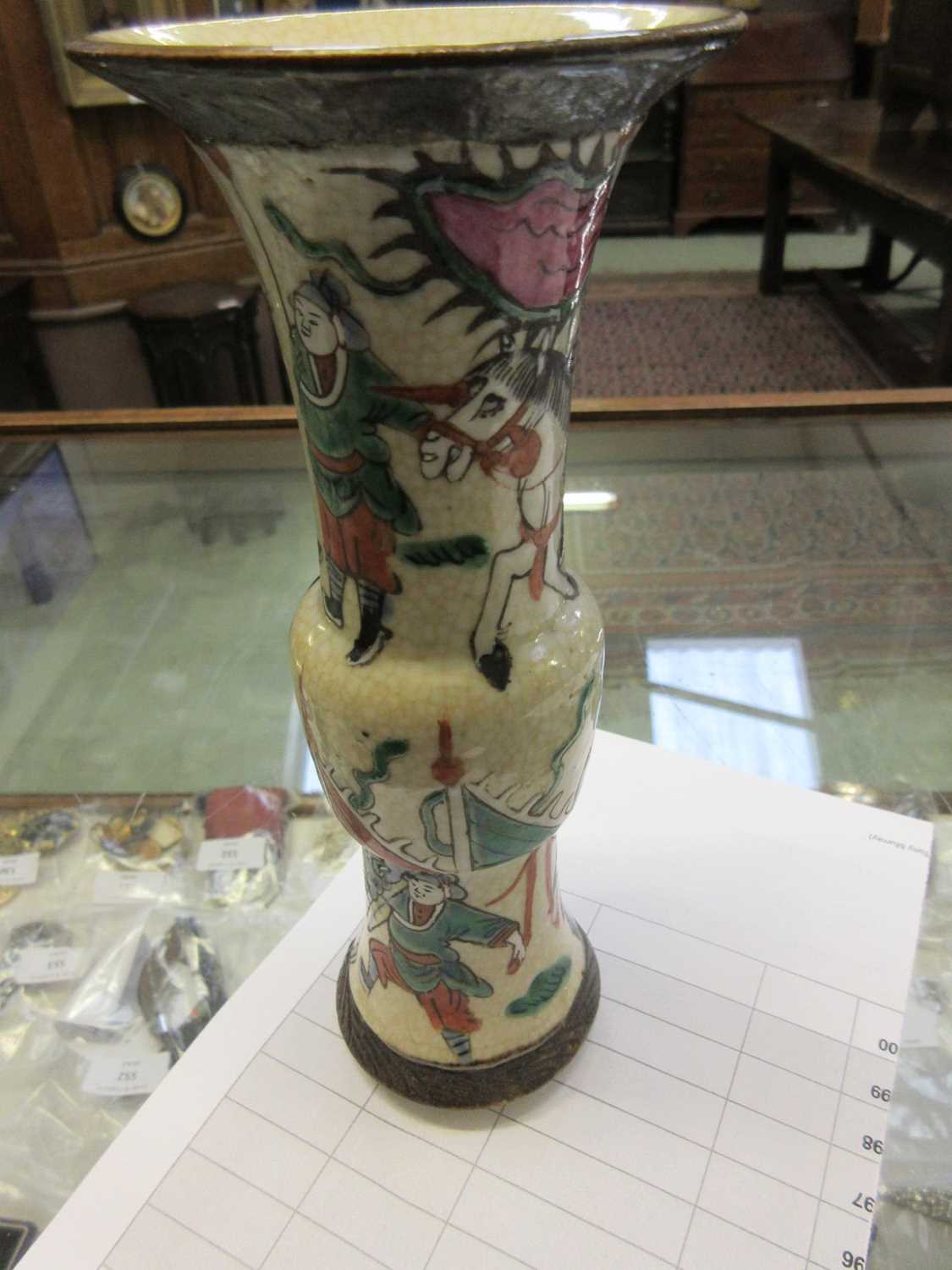 An early 20th century Chinese Gu shaped vase decorated with warriors and horses on wooden base, h. - Image 4 of 5