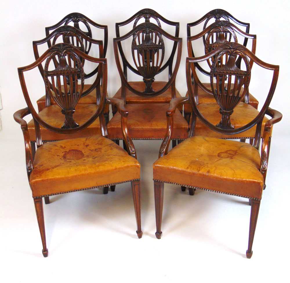 A set of eight early 20th century Hepplewhite style dining chairs upholstered in tan leather, the - Image 6 of 8