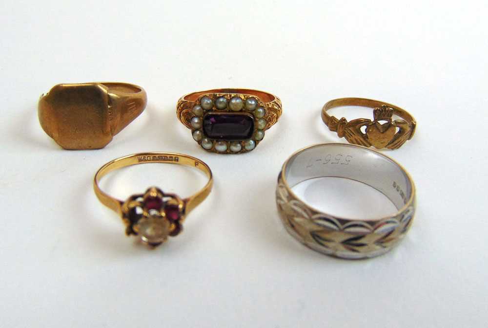 A group of five rings to include a yellow metal, seed pearl and amethyst ring, a 9ct white gold