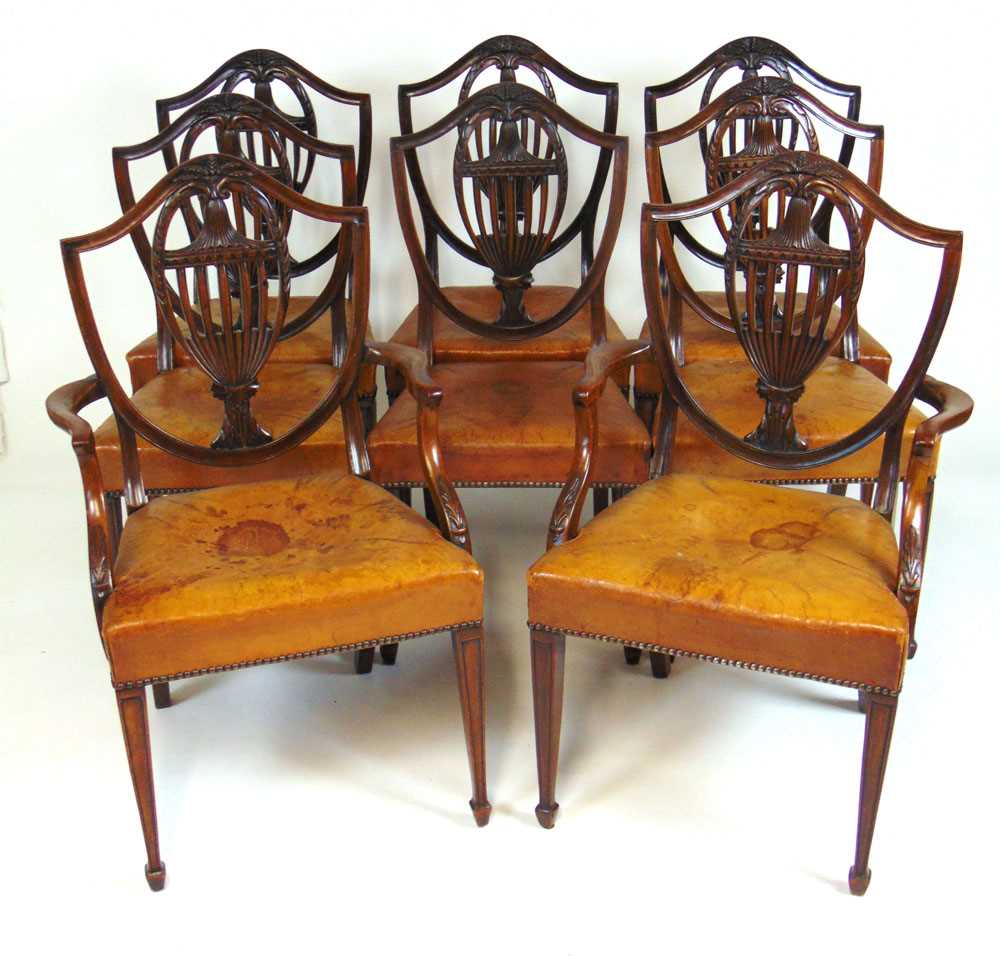 A set of eight early 20th century Hepplewhite style dining chairs upholstered in tan leather, the - Image 2 of 8