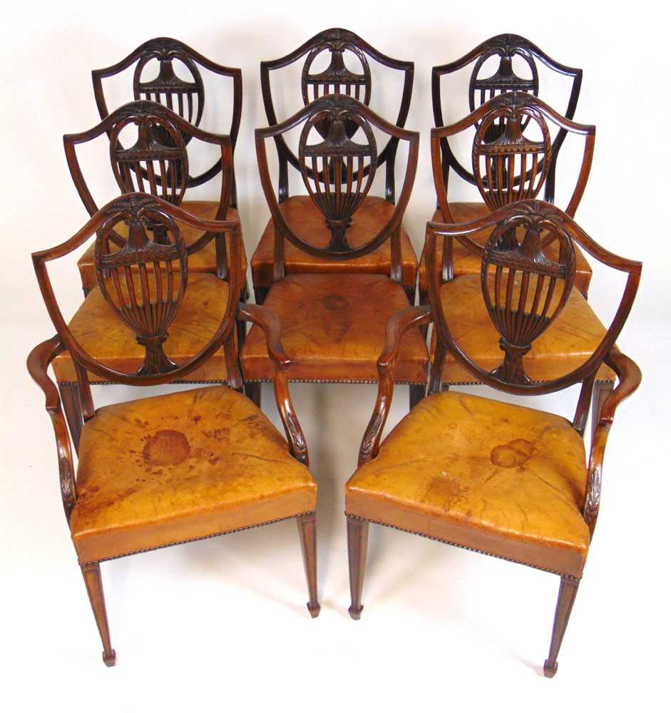 A set of eight early 20th century Hepplewhite style dining chairs upholstered in tan leather, the - Image 8 of 8