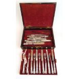 An assortment of Georgian and later silver cutlery in a rosewood canteen. Various hallmarks