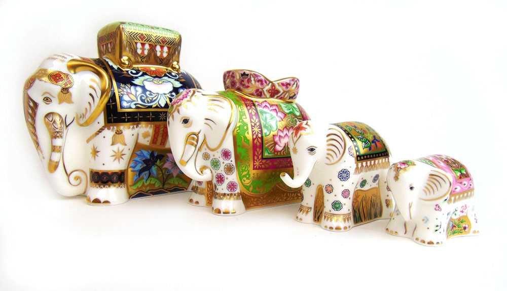 A limited edition set of four Royal Crown Derby elephants, designed by Tien Manh Dinh, including Raj