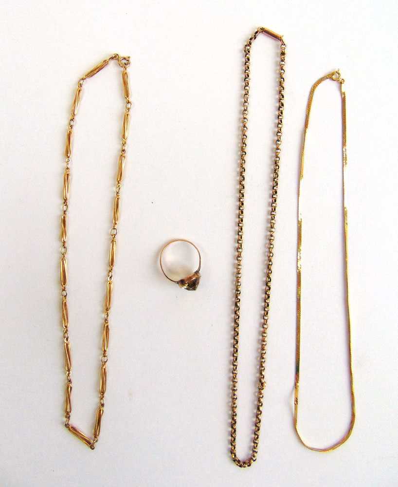 A collection of 9ct gold and yellow metal items to include three chains and yellow stone set ring.