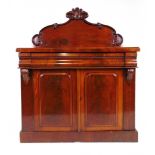 A Victorian mahogany chiffonier, the carved moulded back over a single serpentine moulded drawer
