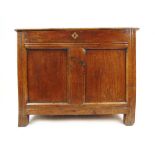 An early 18th century oak coffer of small proportions, the top lifting to reveal a vacant interior