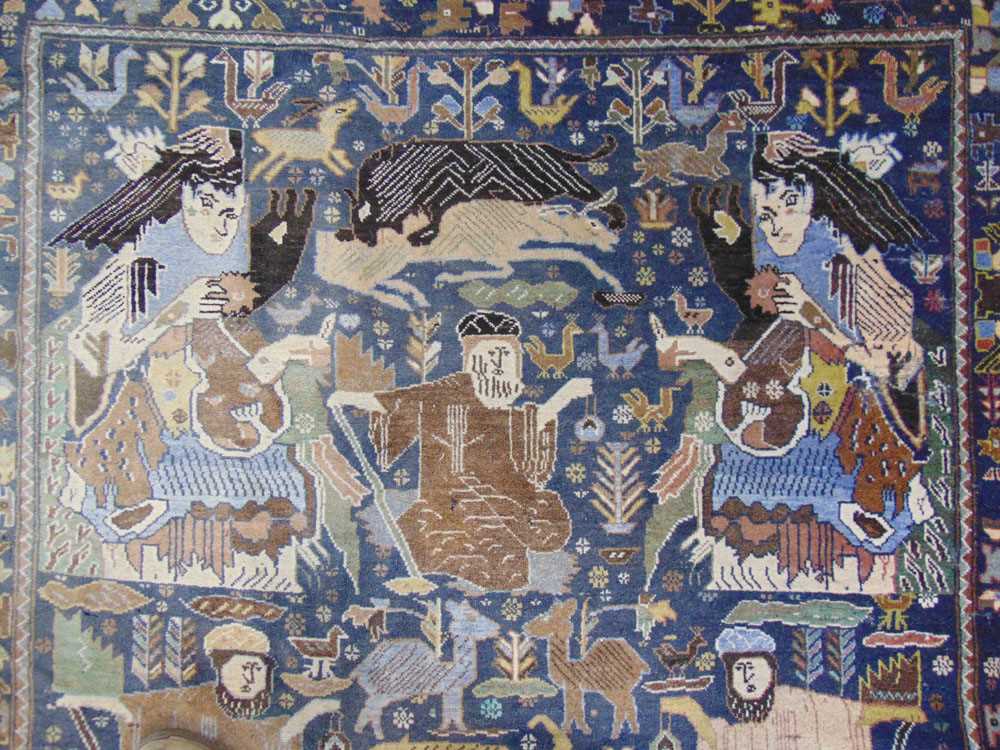 A handwoven Caucasian rug, the main border with animal motifs, surrounding the blue ground field - Image 4 of 5