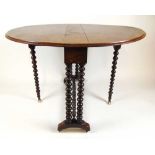 An early 20th century burr walnut Sutherland table, the oval top supported on a single gate action