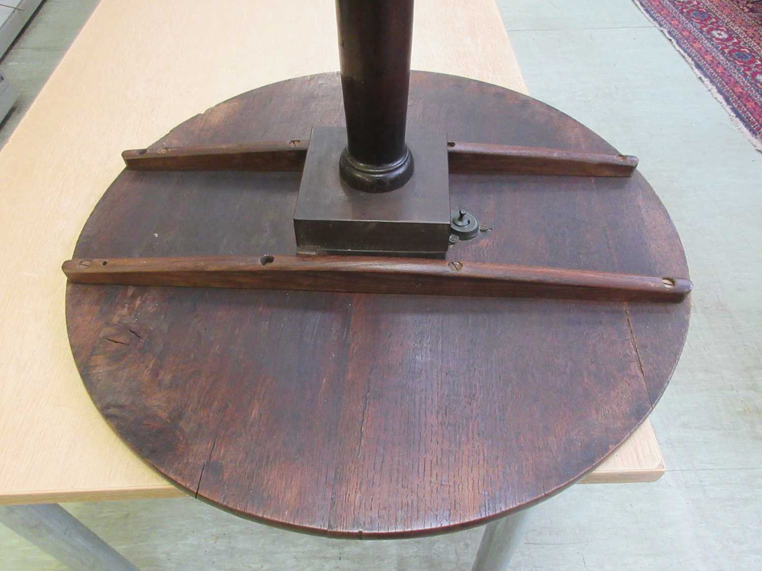 An 18th century oak tilt top tripod table, the circular top on a turned column on three splay - Image 4 of 11