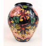 A Moorcroft honeysuckle pattern vase, h. 20.5 cm