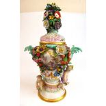 A 19th century Dresden potpourri, the pierced lid with bouquet finial over the florally encrusted